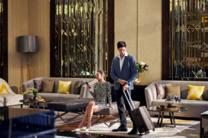 Guests relaxing in the lobby at Chatrium Grand Bangkok.